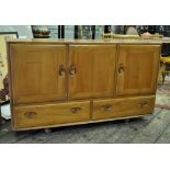 *An Ercol sideboard^ 129cm wide.