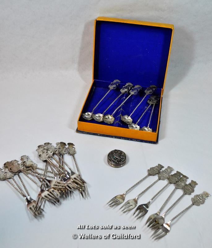 Small sterling silver pill box; a quantity of 800 standard white metal cake forks and small spoons.