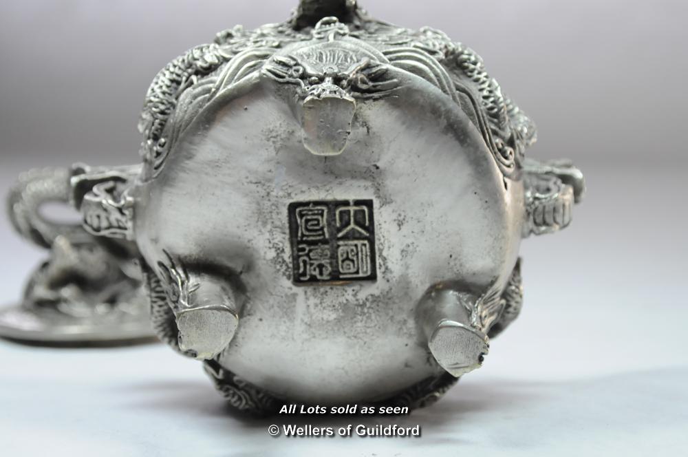 A Chinese circular white metal censor. - Image 3 of 5