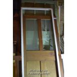 FOUR MIXED DOORS INCLUDING LEDGE AND BRACE PANEL DOOR, PAIR OF 1940'S HALF GLAZED GARAGE DOORS,