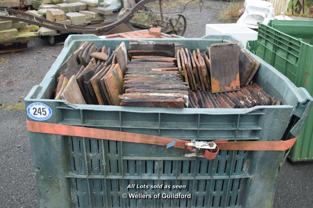 PLASTIC CRATE CONTAINING SINGLE ROOF TILES