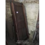 THREE LATE VICTORIAN OAK THREE PANEL DOORS