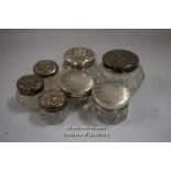 Pair of glass dressing table jars with engine turned silver lids, Mappin & Webb, Birmingham, 1928;