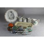 Eight glass paperweights with decorative items including four milk jugs, serving dish and plate