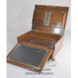 An Edwardian oak lap desk with inset brass handle monogrammed GWB and dated Jan 27 1904, the lifting