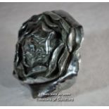 A large silver plated car mascot formed as a rose.