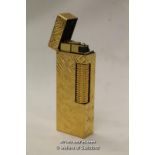 A Dunhill gold plated cigarette lighter.