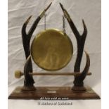 Brass gong with antler horn design