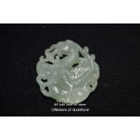 A Chinese hardsstone pendant carved with a dragon.