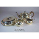 A silver plated three piece tea set; silver plated oval entree dish.