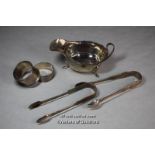 Silver: two pairs of sugar nips, sauce boat, two napkin rings, various dates, 268g.
