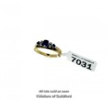 Sapphire and diamond ring, central oval cut sapphire with two single cut diamonds set either side,