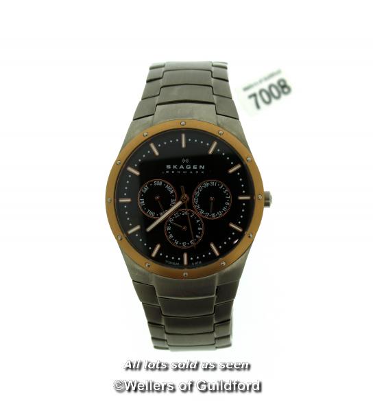 Gentlemen's Skagen Titanium wristwatch, circular black dial with gold coloured bezel, baton hour