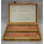 Palynology: A wooden display case containing 100 pollen specimens on microscope slides, all numbered