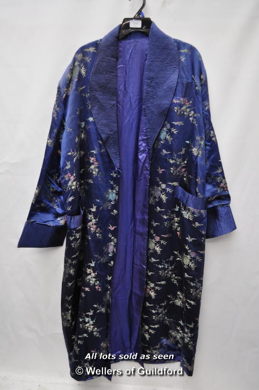 A mid 20th Century Chinese embroidered blue silk robe with collar, long sleeves and pockets.