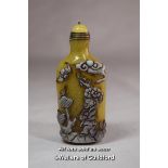 A Chinese yellow glass snuff bottle.