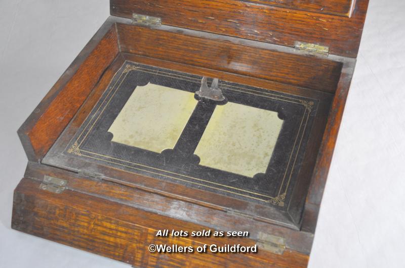 An Edwardian oak lap desk with inset brass handle monogrammed GWB and dated Jan 27 1904, the lifting - Image 2 of 4