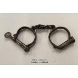 * OLD PAIR OF HANDCUFFS WITH KEY [LQD79](LOT SUBJECT TO VAT)