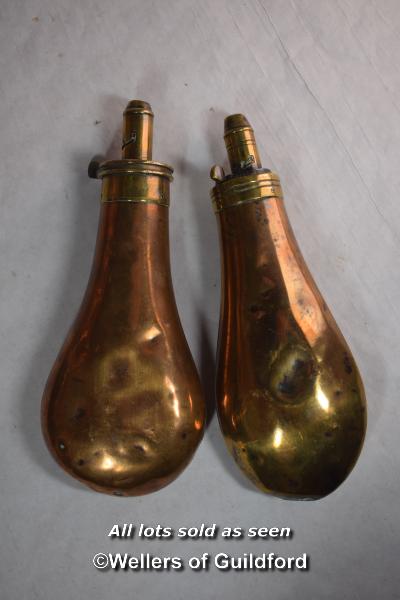 Two Victorian brass powder flasks.