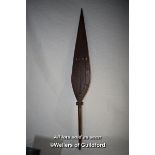 A tribal wooden paddle with pierced decoration, 105cm.