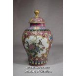 A Chinese polychrome vase and cover, with reserve panels decorated birds and prunus, 21cm.