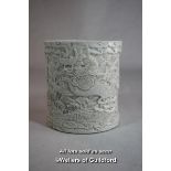 A Chinese cream brush pot carved all over with dragons, impressed mark, 11cm.