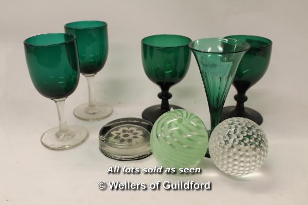 Two pairs of green glass drinking glasses, a similar single example; three paperweights.(8)