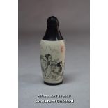 A Chinese cylindrical snuff bottle.