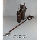 A Shotover shooting stick and two vintage leather-covered thermos flasks.