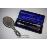 Silver backed hand mirror, Chester 1898; silver handled buttonhook and shoe horn, Birmingham 1903.