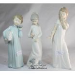 Three Nao figurines of children dressed in night clothes, the tallest 29cm.