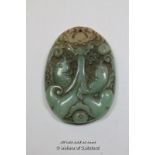 A Chinese hardstone oval pendant carved as a dragon, 5cm.