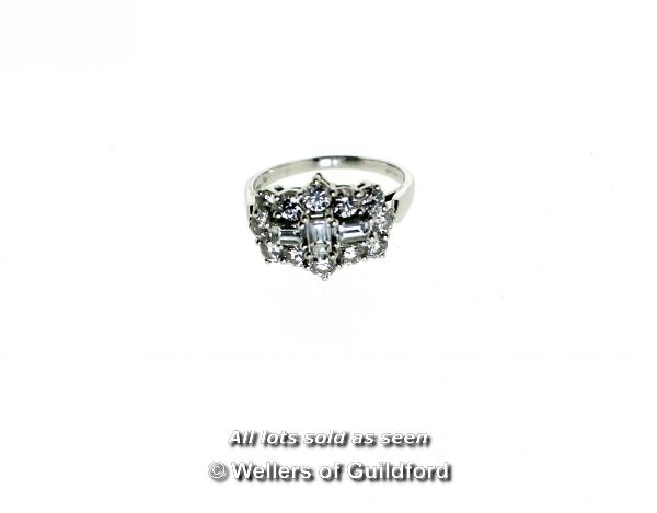 Diamond cluster ring, three baguette cut diamonds to the centre with a surround of round brilliant