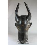 An African wooden mask carved as an antelope.