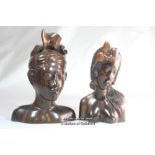 Two Balinese carved ebony heads, the larger signed MD Mider, Mas, Bali, 22cm; the second signed W