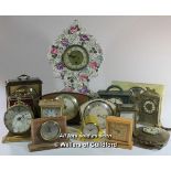 *A porcelain mantel clock and a quantity of mid 20th Century mantel and carriage clocks.