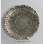 A Chinese white metal zodiac dish with inset coin.