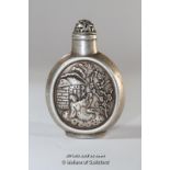 A Chinese white metal snuff bottle repousse with a lady in a garden.