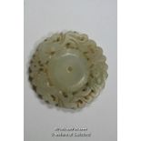 A Chinese carved hardstone pierced circular pendant, 5.5cm diameter.