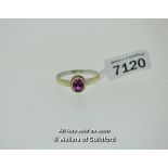 Pink sapphire ring, oval cut pink sapphire rubover set in 9ct yellow gold, on a 9ct white gold band,