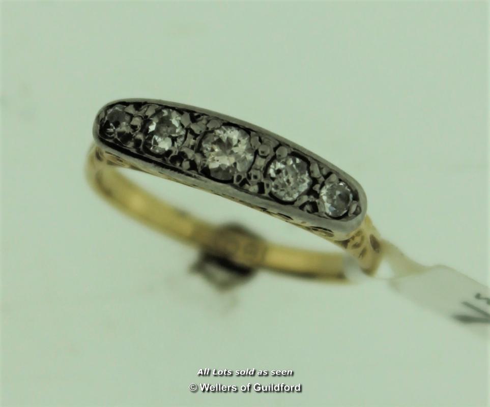 Five stone old cut diamond ring, graduated old cut diamonds mounted in white metal on an openwork