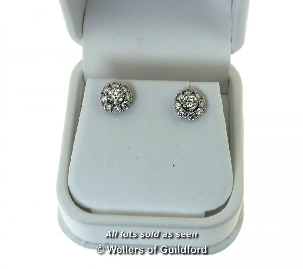 Diamond cluster ear studs, round brilliant cut diamond to the centre with a surround of eight