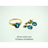 Blue topaz and diamond ring, oval cut blue topaz with three round brilliant cut diamonds set to each