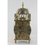 A French brass lantern clock, brass dial with Roman numerals and two train movement, the back