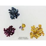 Quantity of loose gemstones, including yellow sapphires, blue sapphires and rubies