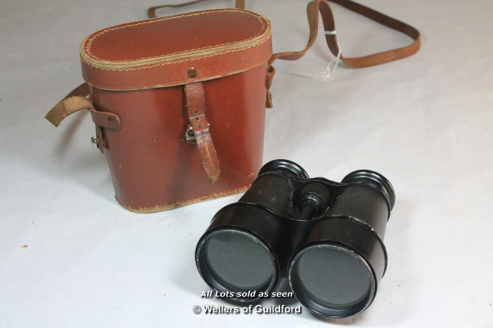 A pair of French made binoculars in leather case.