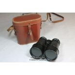 A pair of French made binoculars in leather case.