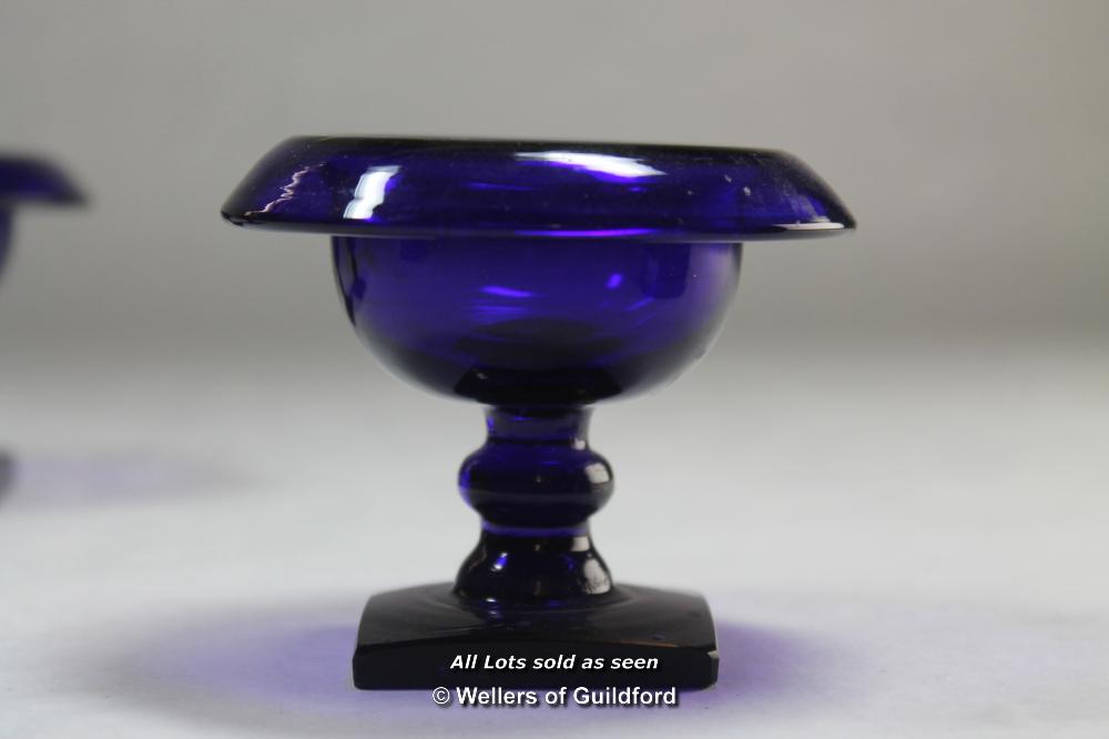 Three blue glass salts with rolled rims, each 7cm high. - Image 2 of 2
