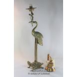 A brass candlestand modelled as a stork standing on a tortoise, 74cm; a modern brass wall-hanging