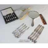 A silver four piece dressing table set comprising hand mirror, comb and two brushes, Birmingham